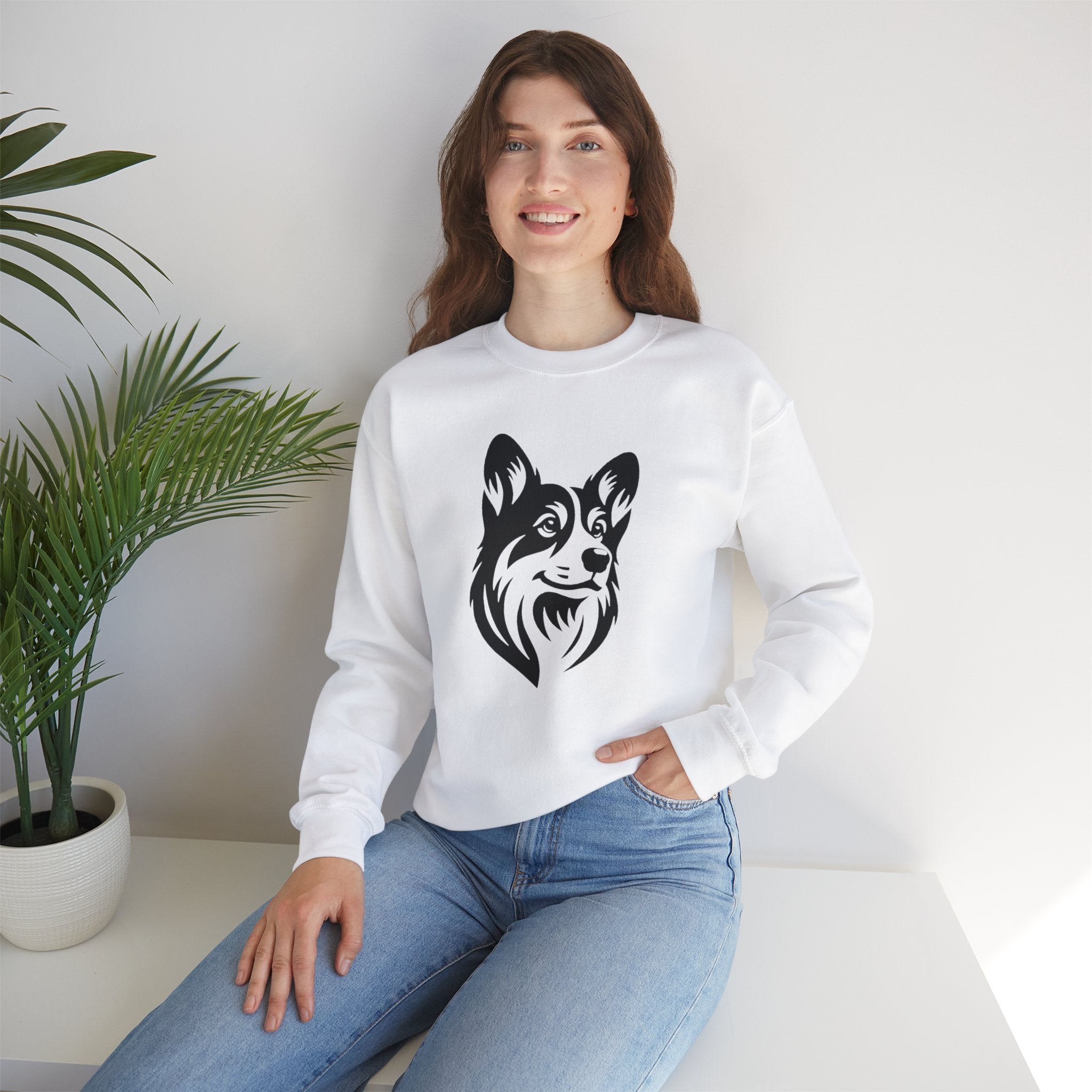 black corgi on white sweatshirt