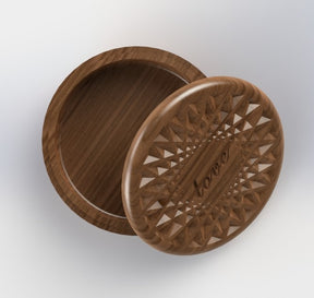 circular jewelry organizer with a diamond pattern engraved with the word love on the lid